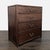 This sturdy dresser features four spacious drawers and elegant brass handles. The solid wood construction gives it a...