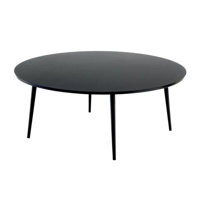 Large round soho coffee table by Coedition Studio Materials: Round coffee table, black lacquered top on MDF. 4 black...