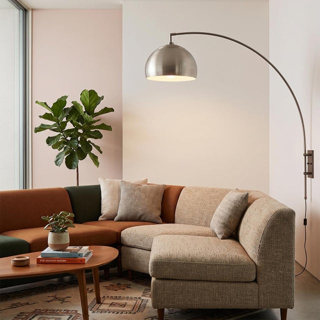 The Half Dome Wall Mounted Arc Lamp is a modern lighting fixture designed by Peter Morelli in 1960. This space-saving arc...