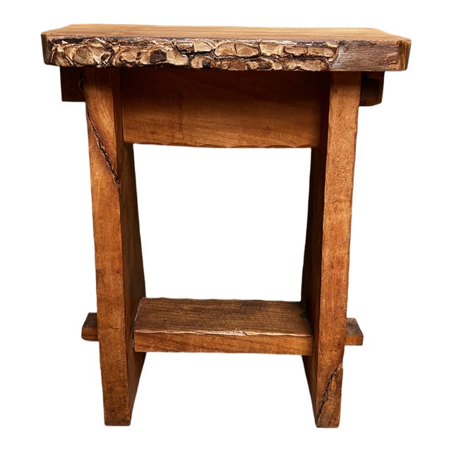 This is a lovely Brutalist-style English Elm stool with a live edge. The size and design make it suitable for various uses...
