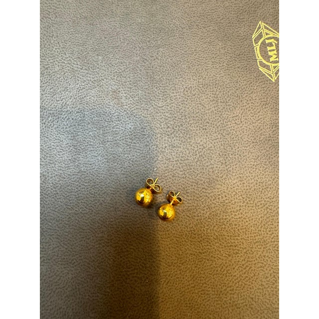 Round Ball Stud Post Earrings 14 Karat Yellow Gold 7.0 MM Round Makes a good gift This exquisite pair of earrings are...
