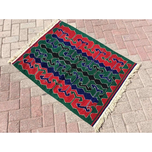 This beautiful, vintage, handwoven kilim is approximately 60 years old. It is handmade of very fine quality, hand-spun...