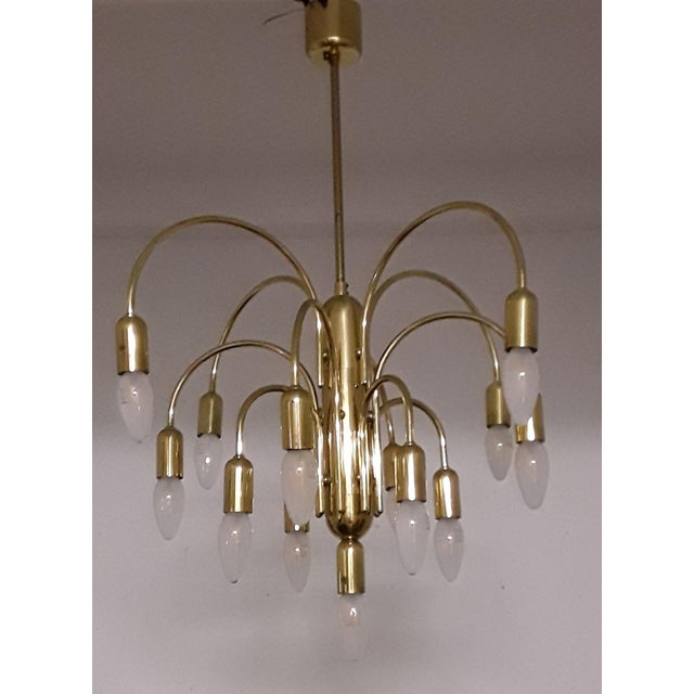 German Gold-Colored Chandelier with from Sölken, 1970s, in Good conditions. Designed 1970 to 1979 This piece has an...