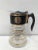 Black and gold carafe/coffeepot by Hollywood Regency designer David Douglas. Heat resistant and as such suitable as...