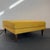 This oversized Mid-Century Modern style square ottoman features a double cushion design upholstered in a mustard-yellow...