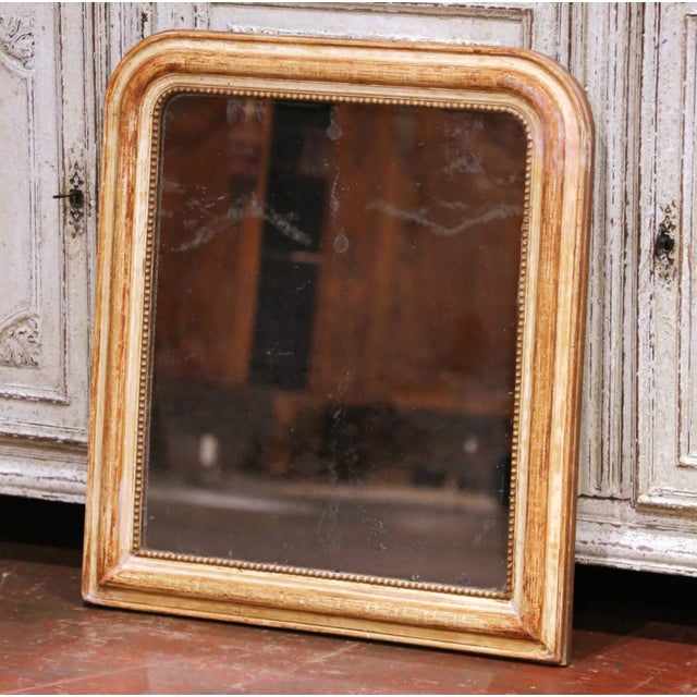 Decorate a powder room, bedroom, or entryway with this elegant antique wall mirror from France. Crafted circa 1870 in the...