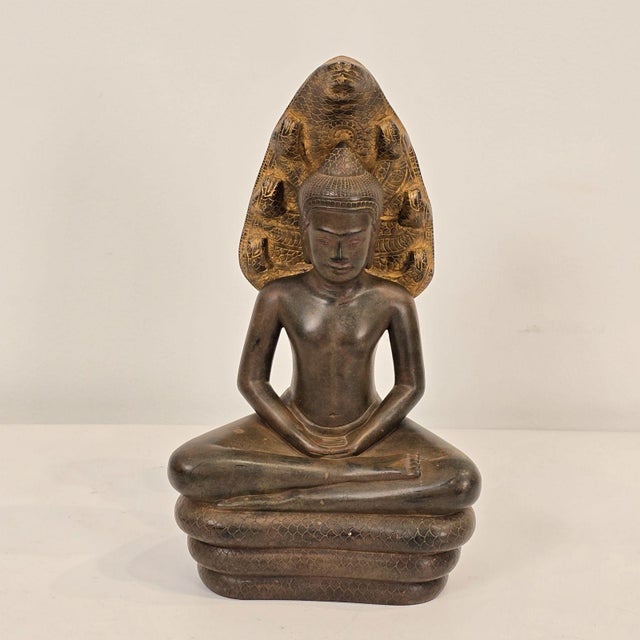 A Naga Buddha bronze, Thailand, 19th century. This Buddha is in the meditation pose.