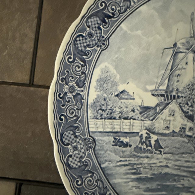Bring timeless European charm to your home with this **Vintage Boch Belgium Delft Windmill Scene Wall Charger Plate**....