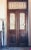 Large French painted double entry doors with transom frame. Wrought Iron work insert in door frame and top. Nice high...