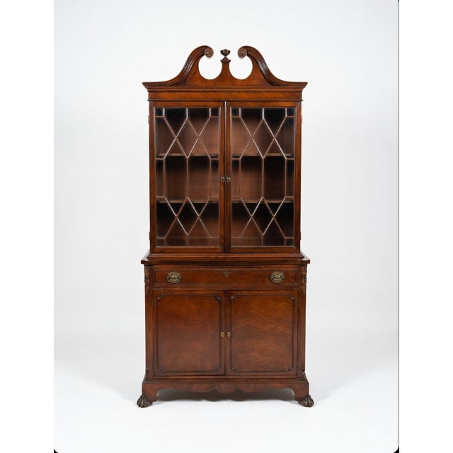 Discover timeless elegance with this vintage mahogany china cabinet, a perfect showcase for your finest dishware,...