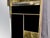 The Magnificent black Murano glass and brass wall mirror with square geometric trim is an extraordinary piece of modern...