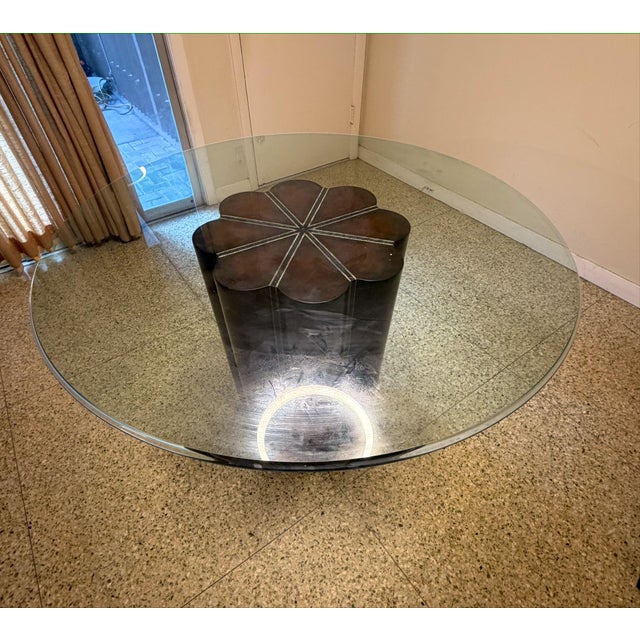 A genuinely sculptural pedestal table: a scalloped, eight-lobed column in a richly oxidized bronze-and-pewter patina,...