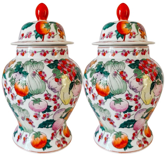 A striking pair of vintage Chinese export porcelain temple / ginger jars, hand-enameled with vibrant overglaze motifs of...
