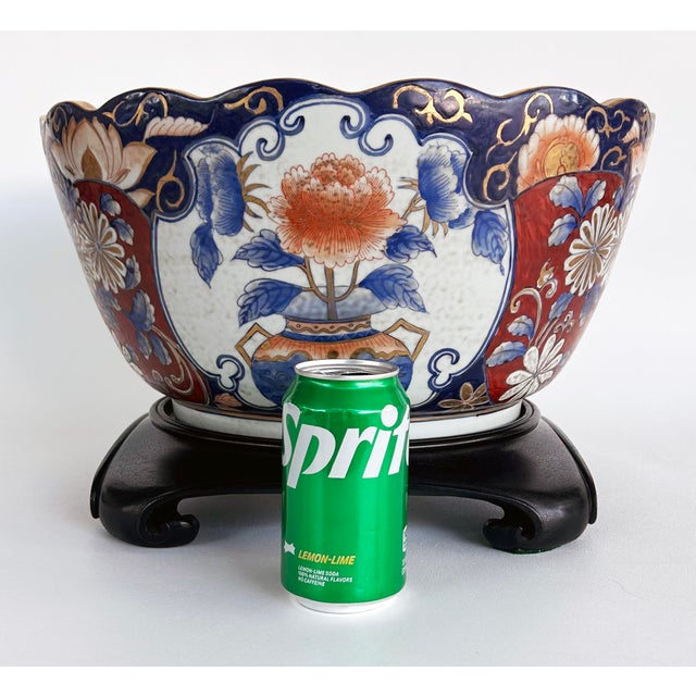 Mid-20th Century Gilt Japanese Imari Decorative Bowl, Wooden Stand Offered for sale is a mid-20th century Japanese...