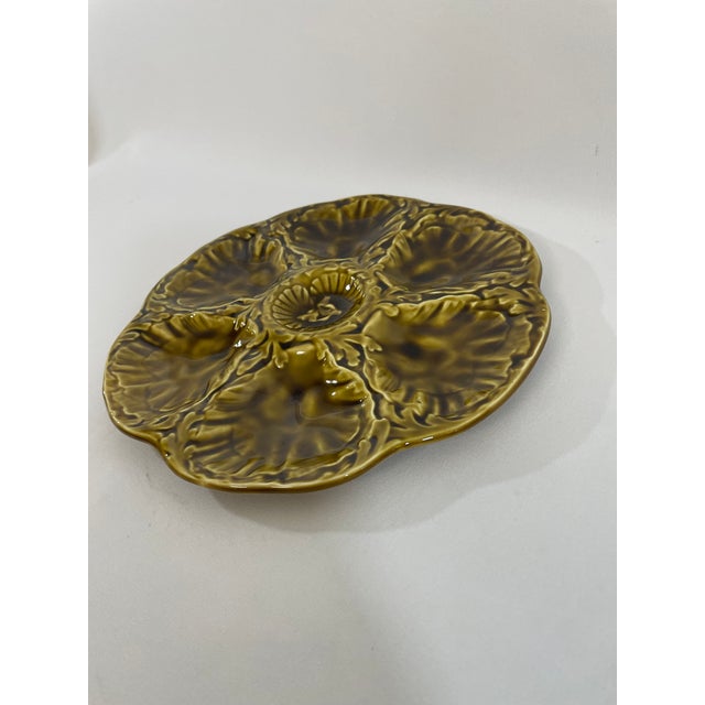 A striking glazed earthenware French Majolica (or barbotine) Oyster Plate crafted by the famous Gien workshop in France....