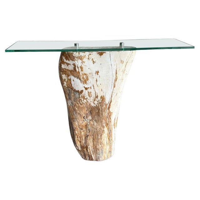 High quality petrified wood console table base with a glass top screwed into the center securely with stainless steel...