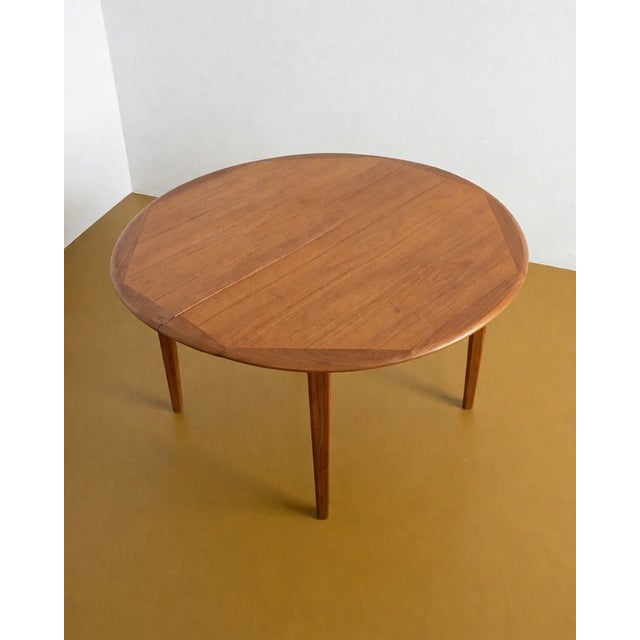 A vintage Danish teak extendable table from the 1960s with an elegant extension system, perfect for a versatile and...
