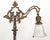 Victorian style bridge arm floor lamp made of cast iron and brass with a bell shaped iridescent stenciled glass shade....