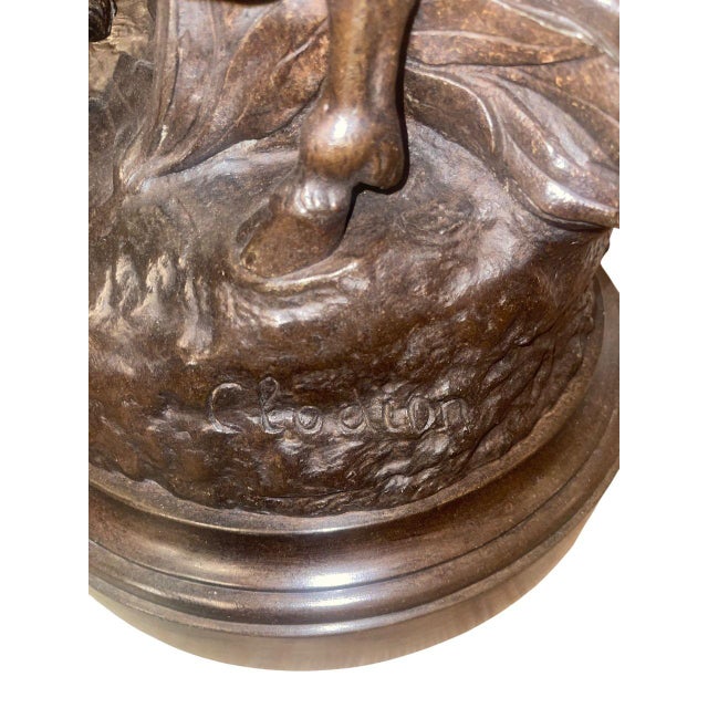 A monumental 18th Century French bronze Bacchic sculptural group signed Clodion. The sculpture depicts an elegant...