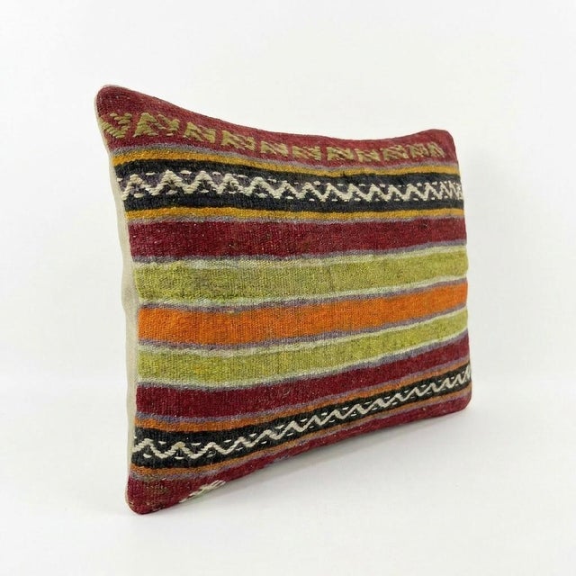 This beautiful 15'' x 23'' hand-woven Kilim pillow cover was made from an authentic Turkish kilim. The traditional flat-...