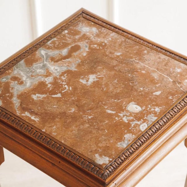 This historic side table was made around 1890 and features a design typical of the late 19th century, combining a curved...