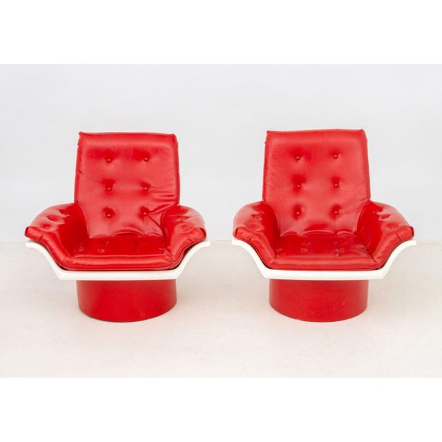 Pair of Morris Futorian "Space Age" Lounge Chairs, with red vinyl upholstery and white plastic frames on red circular...