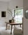 Vintage solid oak center table. This large wooden table features a grainy wooden table top with mitered corner joinery,...