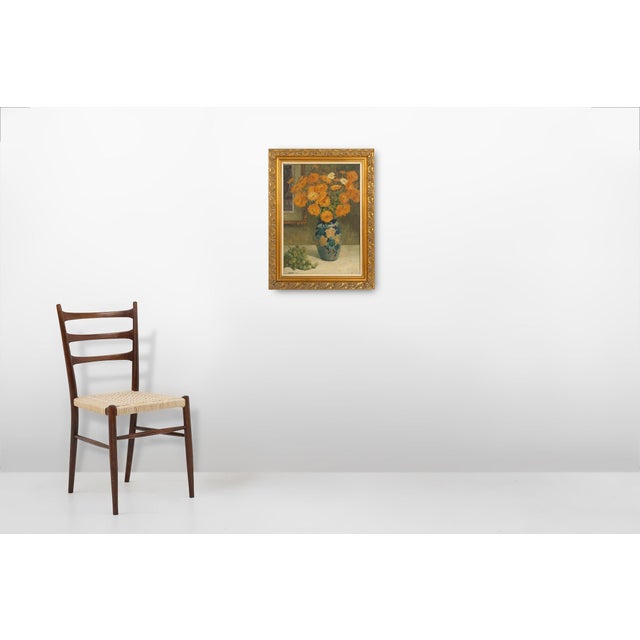 A beautifully composed oil painting by belgian artist jos pas, dated 1944, capturing the timeless elegance of a floral...