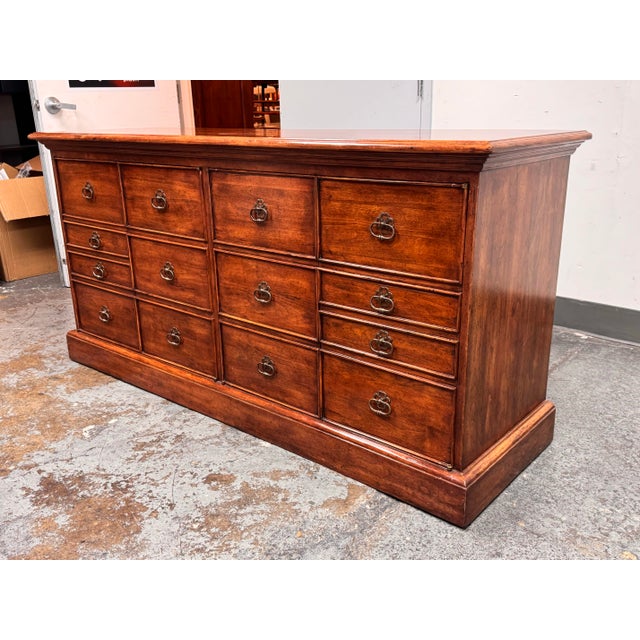 Design Plus Gallery presents a Sideboard from Bausman & Company. This sideboard has a wide silhouette with paneled doors...