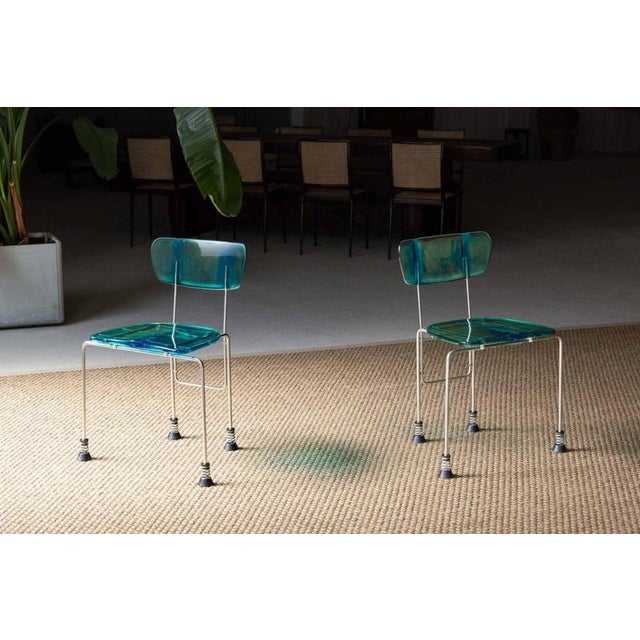 The sculptural Broadway chair, designed by Gaetano Pesce and produced by Bernini in Italy in 1993, is a striking example...