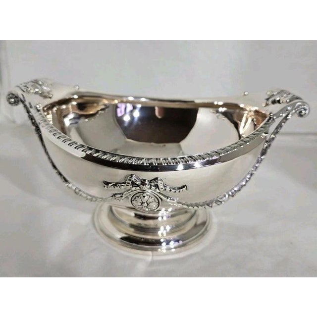 A fine vintage sterling silver cake compotier, tazza or bon bon dish dating to 1965, displaying elegant traditional...