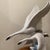 This large porcelain sculpture, titled "Swans Group in Flight," captures the elegance and grace of swans in motion....