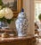 A classic blue and white ginger jar, decorated throughout with delicate flowering cherry blossom branch motifs. The...