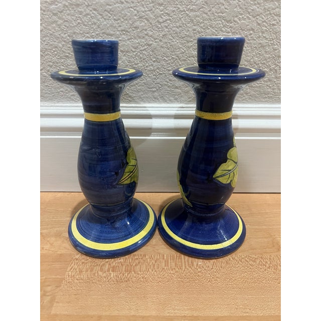 These pretty vintage candlesticks will brighten up any table. Hand painted bright Yellow Sunflowers with a Blue...