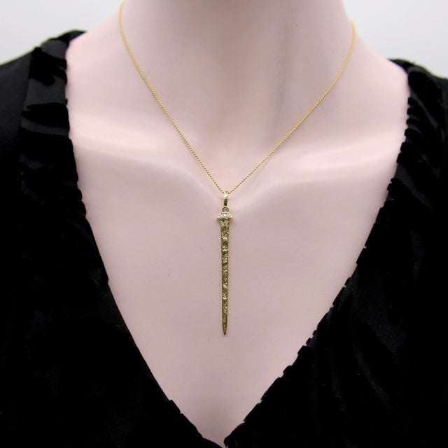 This is part of Chairish’s Fine Jewelry assortment. This hand-engraved 14k gold pendant was inspired by an original L....