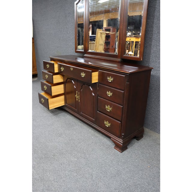 Classic dresser by Kincaid Furniture crafted in solid mahogany. Features nine drawers and two center cabinet doors with...