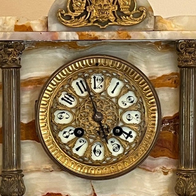 This exquisite late 19th-century French mantel clock is a timeless statement piece. Featuring a beautifully veined,...