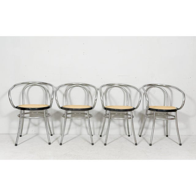 Set of 4 dining chairs, Germany, 1990s, tubular steel frame with plastic weave, Dimensions approx.: H: 77.5 cm, W: 50.5...