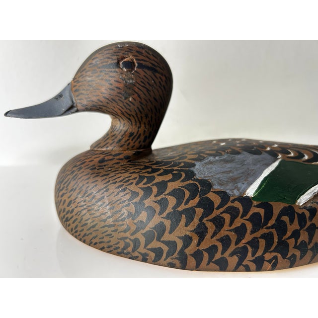 Decorative wood-carved Green-winged Teal hen or Garganey hen, has a distinctive green speculum patch on its wing and the...