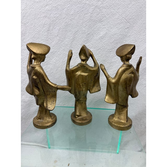 Trio of Mid Century Modern Iron Geisha Girl Dancing figures. These are painted gold. They are 8" tall.