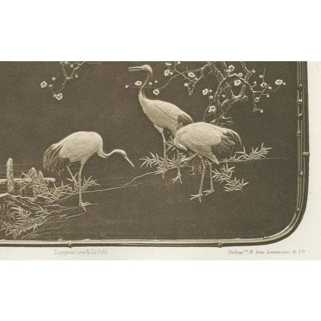 Title: cranes and blossoms in an ornamental scene – plate xv from section vi of g. A. Audsley’s decorative art series :...