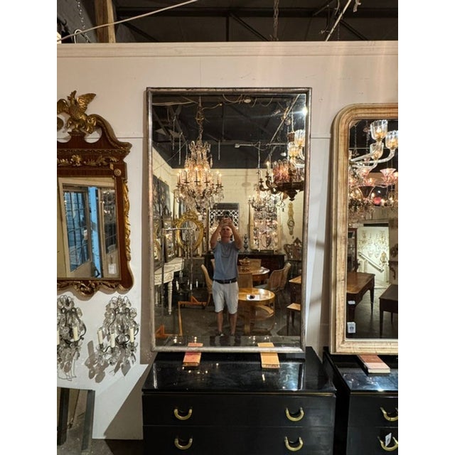 The 19th c. French Transitional Silver Leaf Mirror is a luxurious addition to any room. This mirror features intricate...