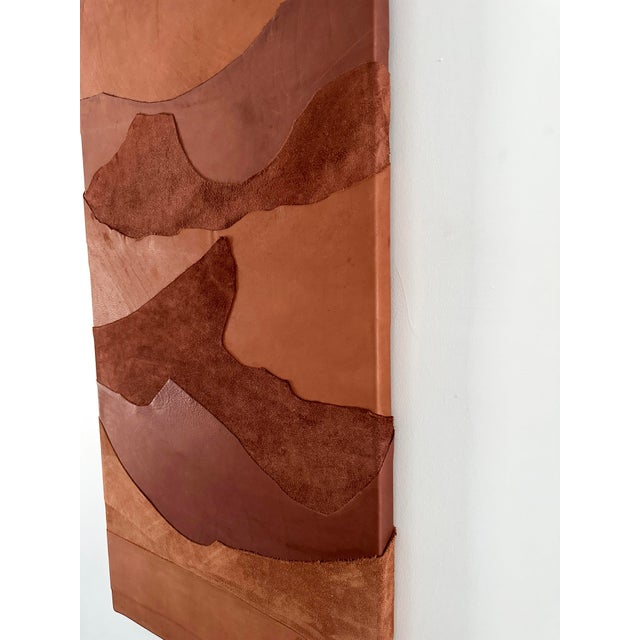 This piece, made of layered leather, evokes the red desert mountains you can see in the western states of America. It...