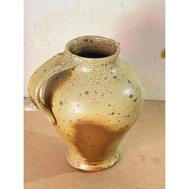 Jug or pitcher with an exceptional patina. It's color with beige and brown gives very pleasant contrasts. This pitcher was...