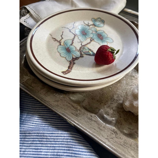 Lovely set of English stoneware plates, by Temperware, they depict a cherry blossom branch with a small bird resting in...