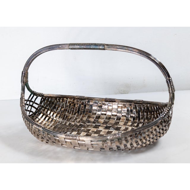 We are selling this nice decorative Silverplate wire basket. This basket has cool Mid-century vibe and form. The basket is...