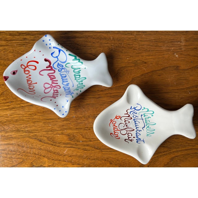 This charming pair of faience trinket dishes/catchalls/ashtrays are from the famed London, Mayfair, seafood restaurant,...