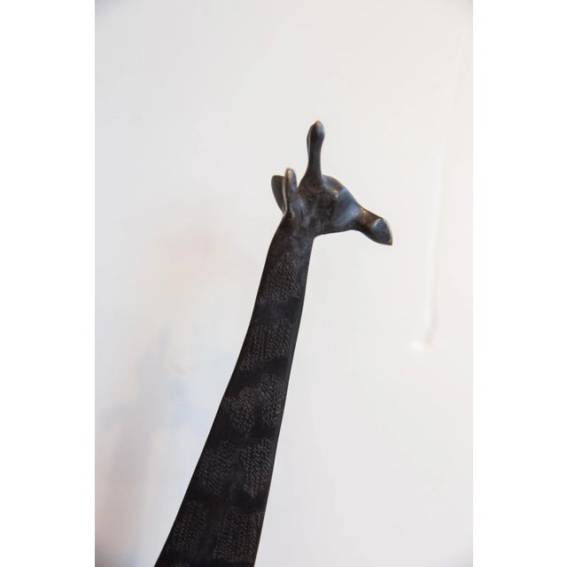 :: Vintage handmade African giraffe with dark patina. Made approximately 40-70 years ago, each figure in this collection...