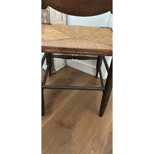 Late 19th century signed L Hitchcock rush seat arm chair. The chair is in very good condition.