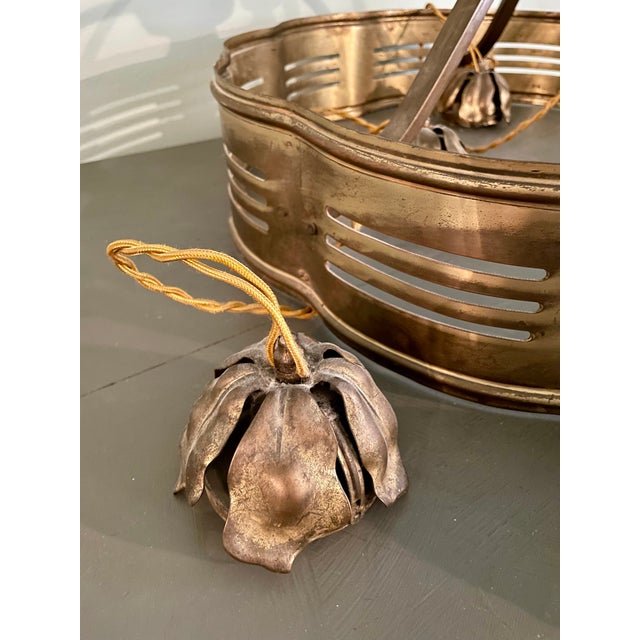 Stunning early 20th century large brass light fixture originally from a theater. The 7 sockets, each surrounded by brass...